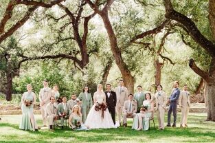 Dynamic wedding party with a bride and groom in the center